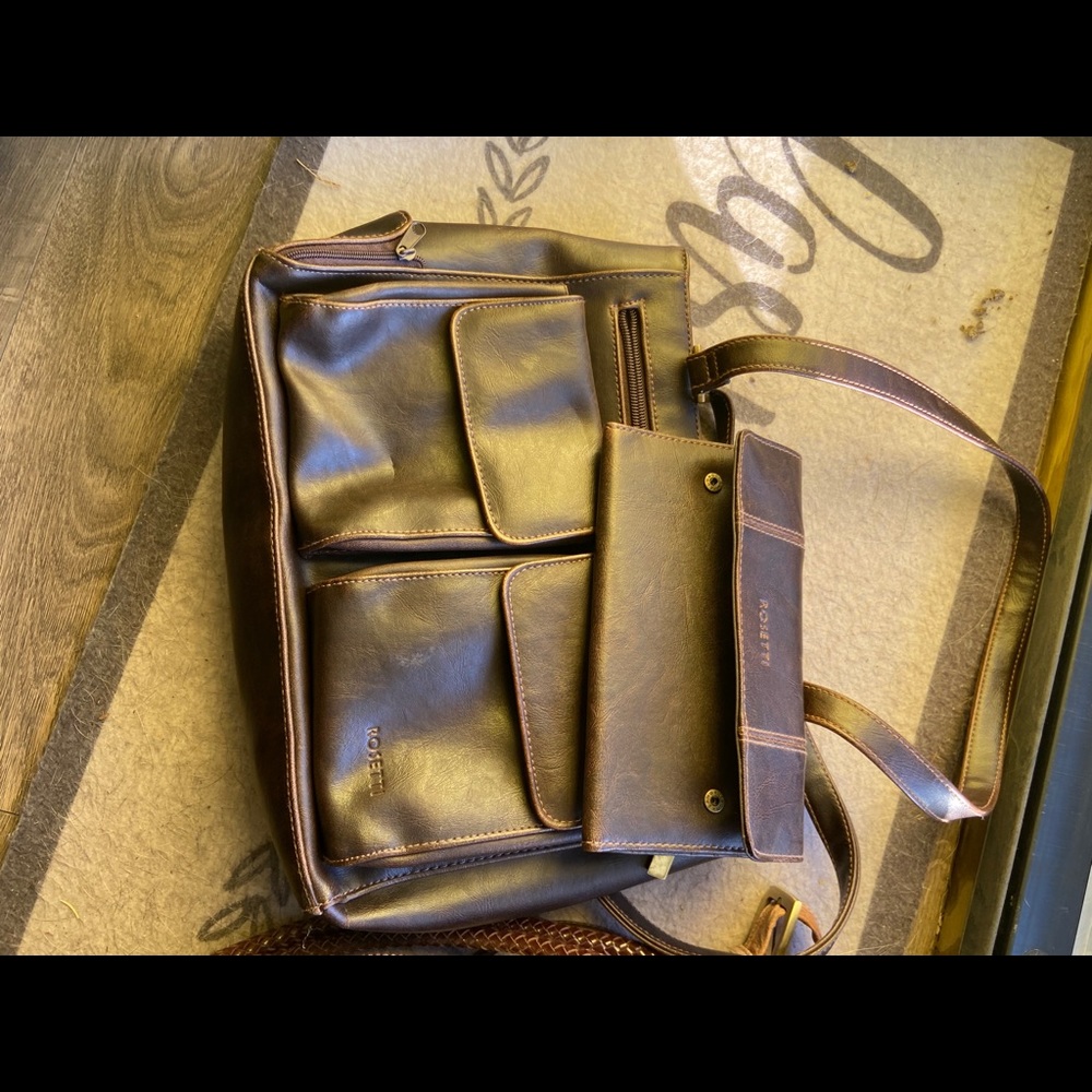 A bunch of different purses and women wallets